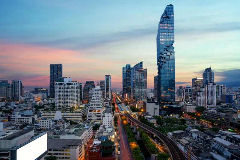 Bangkok city skyline at sunset featuring Mahanakhon tower – Ken Brown Financial Consultant based in Thailand serving American expats across Southeast Asia