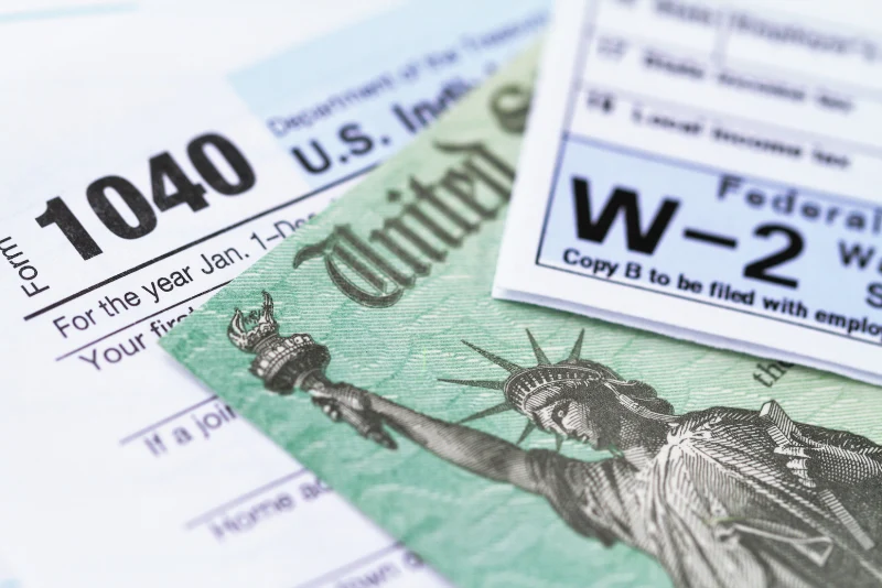 US Form 1040 individual income tax return and W-2 wage statement for American expats filing US taxes while living abroad in Thailand